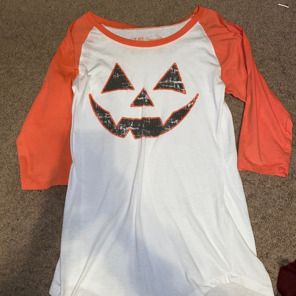 white baseball styled Pumpkin face shirt